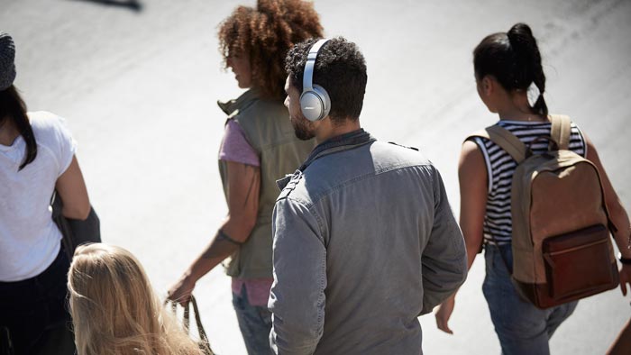 Image of QC35 on the man in crowd.