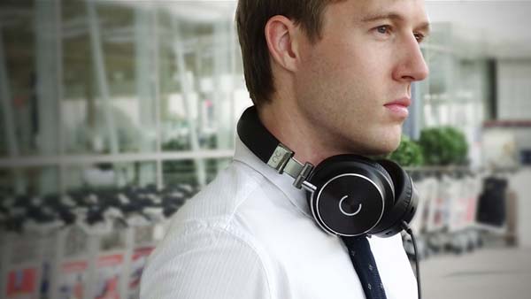 Man wearing Cleer NC headphones on commute