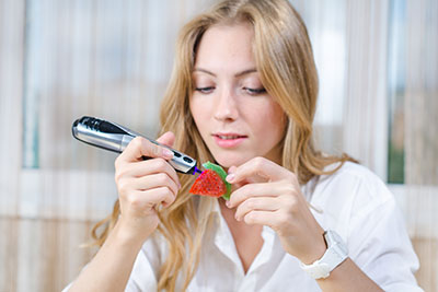 Image of girl using 3D printing pen