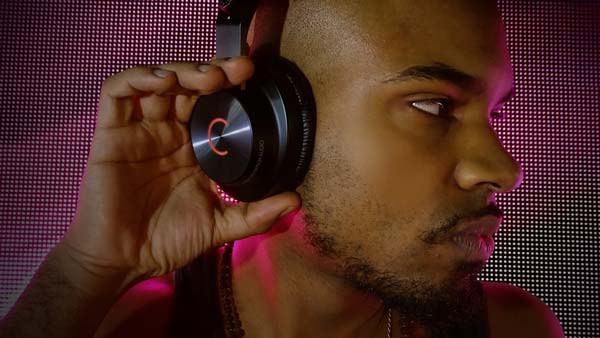 Man wearing Cleer DJ headphones on Stage