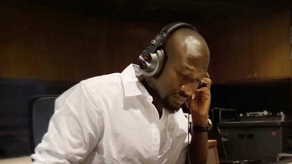 Man wearing Cleer DJ headphones in Studio
