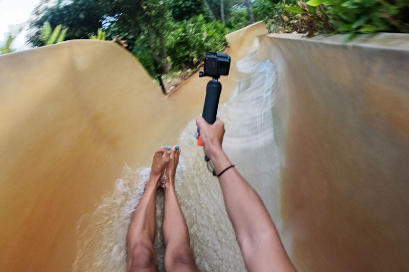 Image of woman in waterslide with Handler.