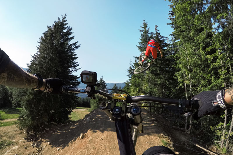 Image of mountain bikes in mid air jump.